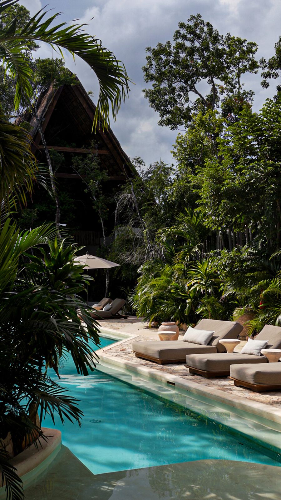 Jungle pool with daybeds