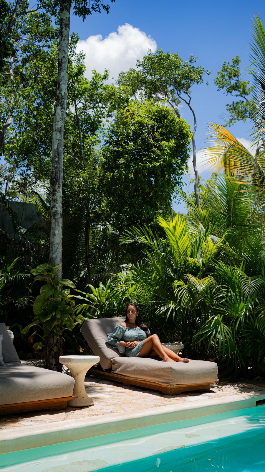 Relaxing on a jungle pool lounger